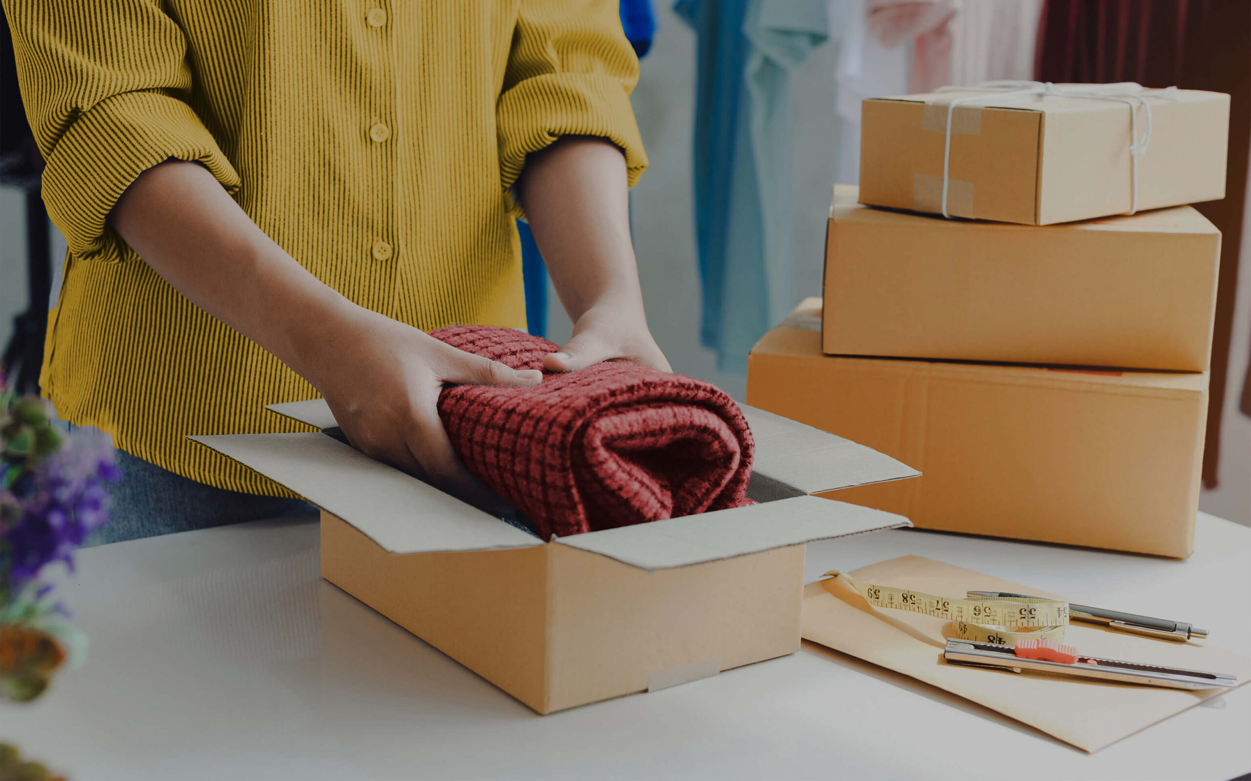 Person handling a package for e-commerce delivery