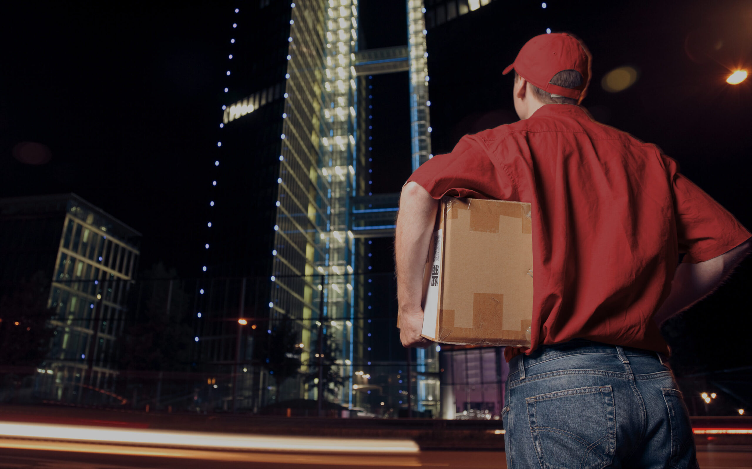 Person delivering a package at night