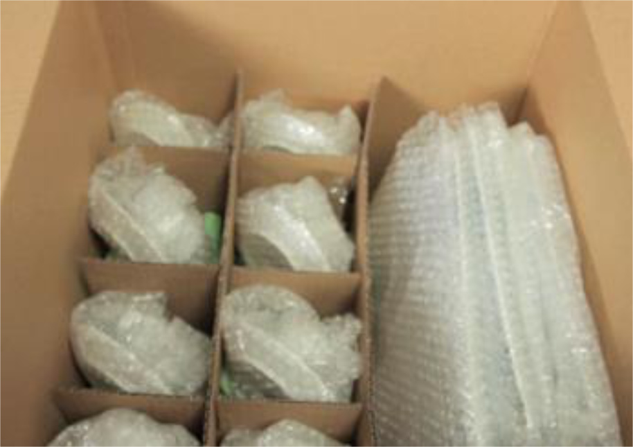 Box with fragile items wrapped in bubble wrap